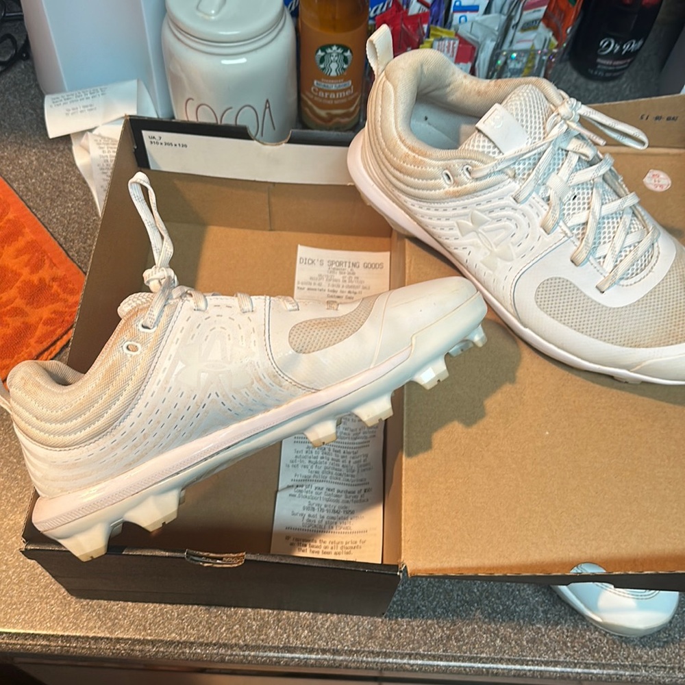 Only wore once. Ladies softball cleats.